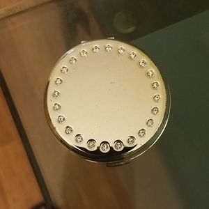 A silver and crystal purse magnifying mirror